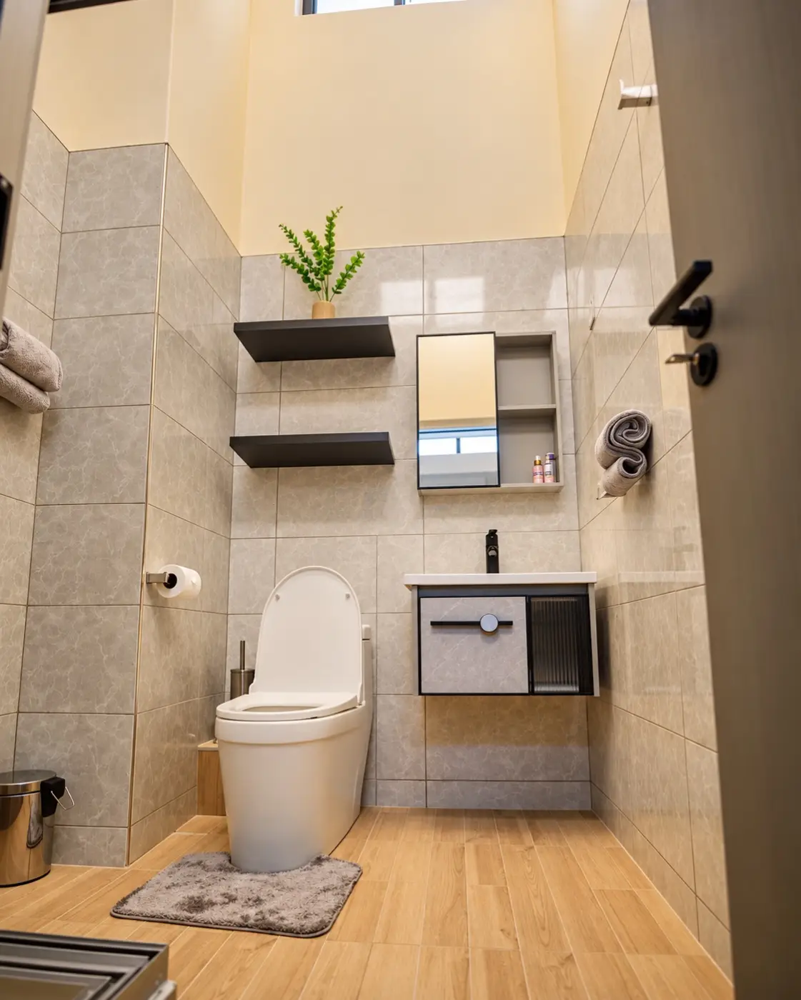 Shower room with grey tiles